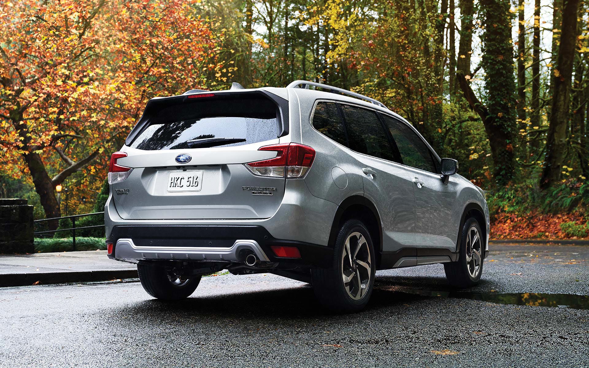 The rear of the 2022 Forester on a neighborhood street. | Sunset Hills Subaru in Sunset Hills MO