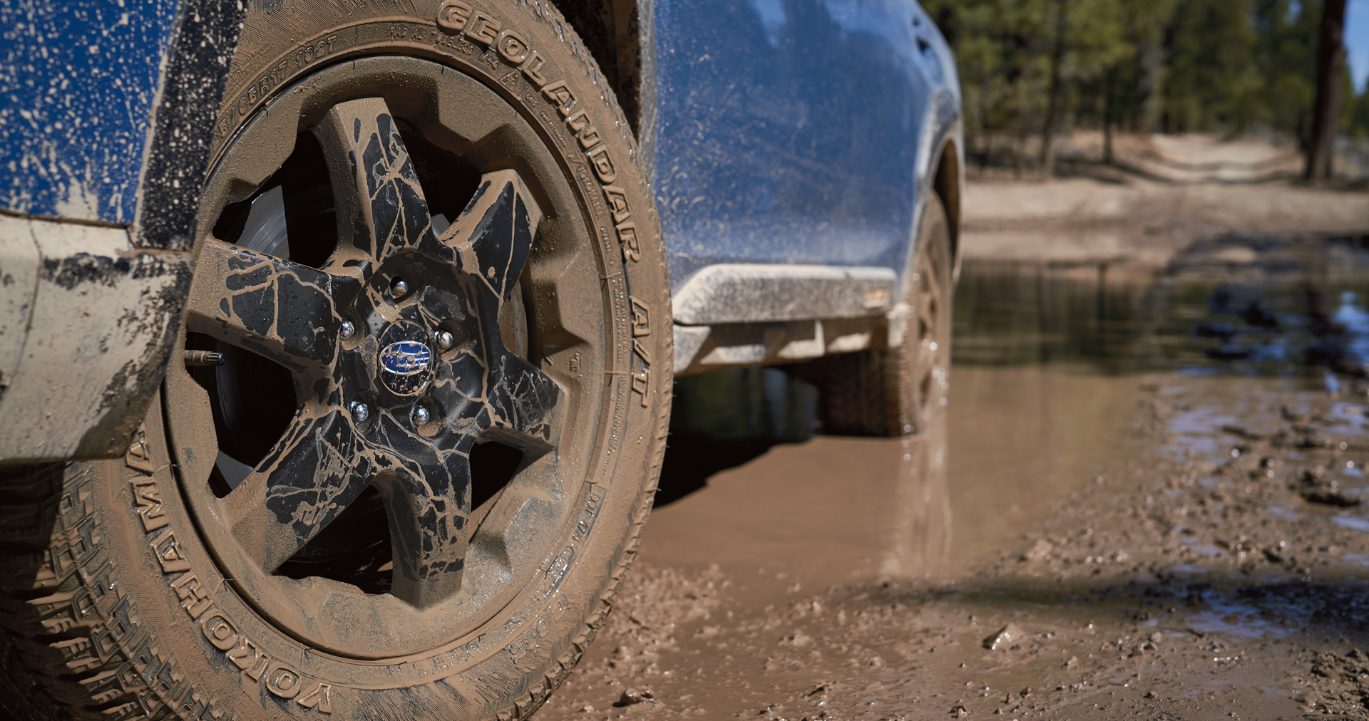 A close-up of the 17-inch off-road wheels and all-terrain Yokohama GEOLANDAR® tires on the 2023 Outback Wilderness. | Sunset Hills Subaru in Sunset Hills MO